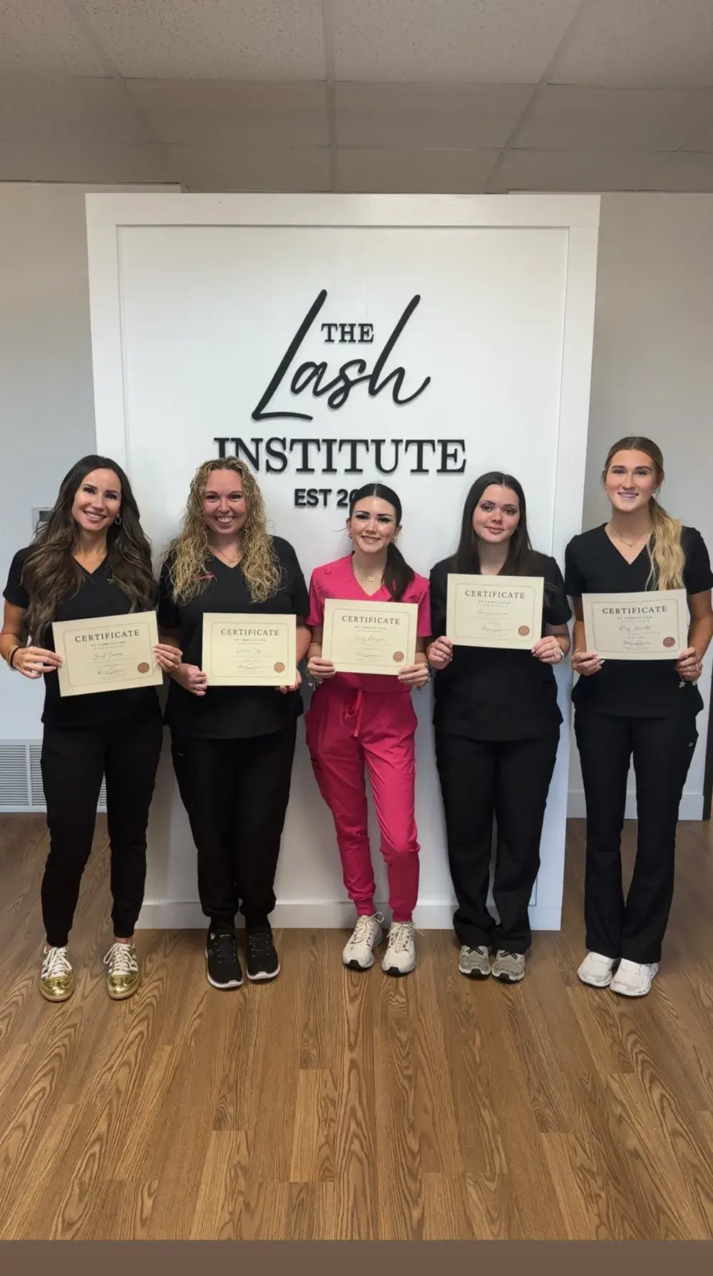 The Lash Institute graduates holding their certificates